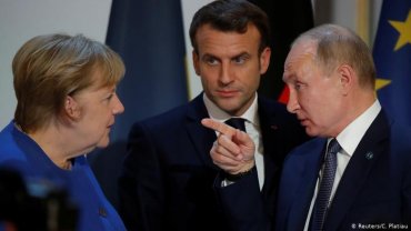 Меркель назвала Путина победителем на саммите в Париже